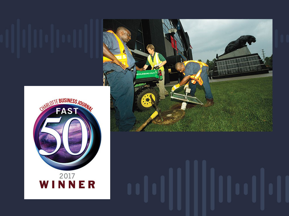 Charlotte municipal workers using SL-RAT over a manhole with the Fast50 winner badge