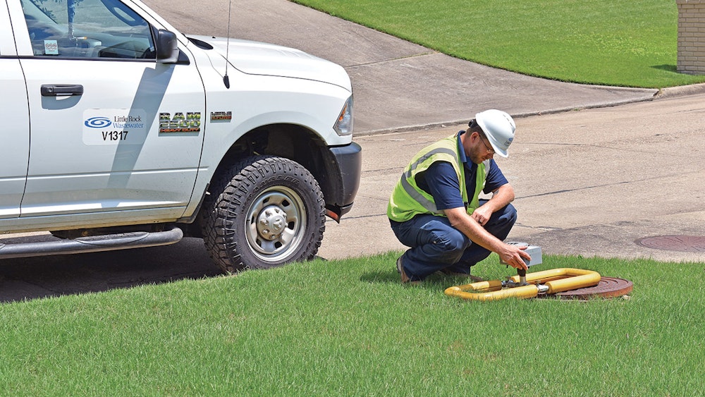 Person bending down looking at SL-RAT